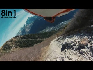 flying parachutist in a wingsuit suit gives a high five / wingsuit standing on the ground   high five   fly by   teaser sammy rohan