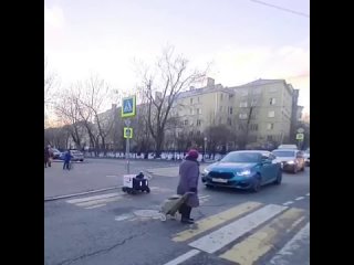 grandmother helps the robot to cross the road